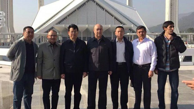 Abdujelil Hajim (second from right) stands with fellow officials from the Kashgar Prefectural Trade Association, in a file photo