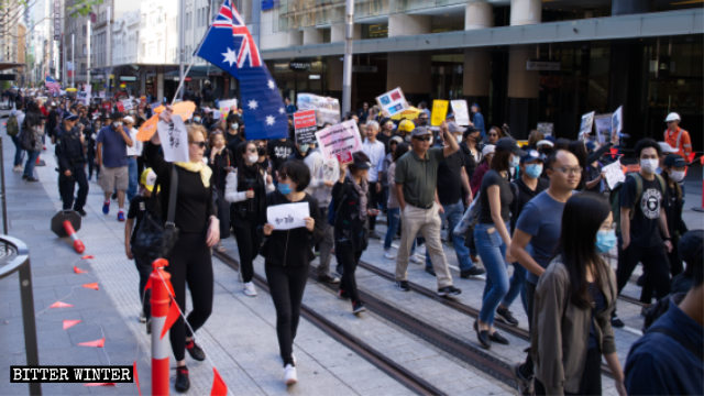 More than 1,000 supporters of the Hong Kong protests march on the streets of Sydney.