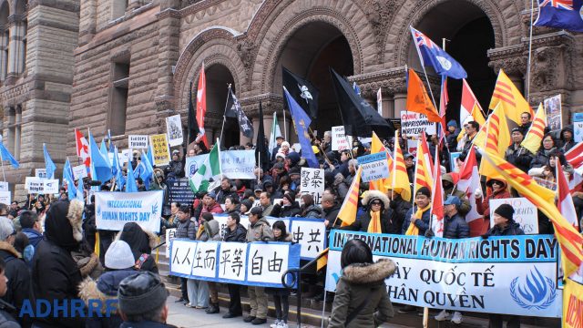 At noon of December 8, hundreds rally before the Old City Hall in Toronto