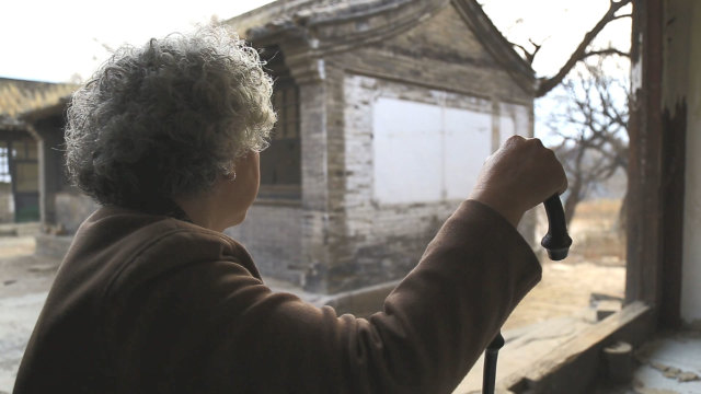 elderly woman awaiting her family