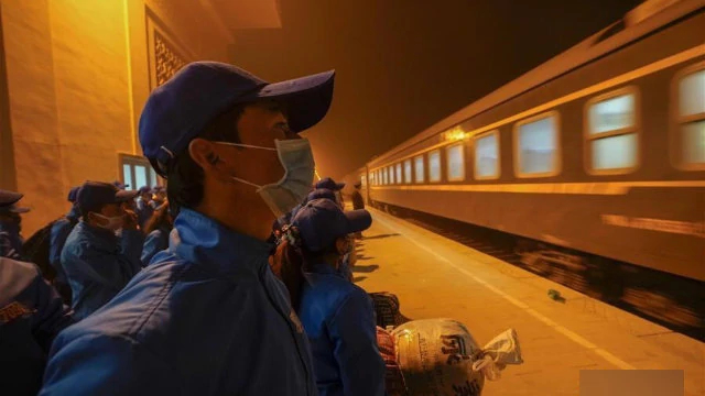 Workers at a railway station in Hotan’s Moyu county in March, on their way to northern Xinjiang.