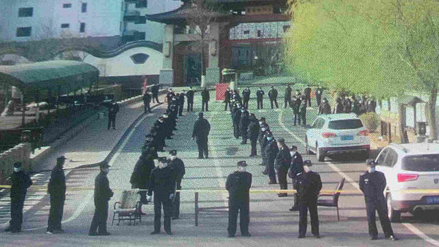 Nearly 100 police officers cordoned off the intersections leading to the Jiulong Temple.