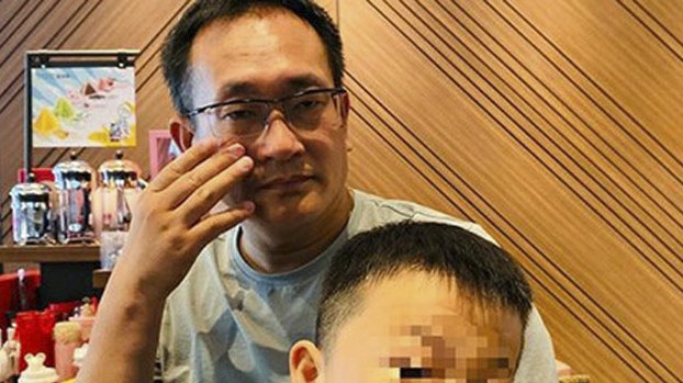 Chinese human rights attorney Wang Quanzhang, with his son after his release from a four-and-a-half year jail term for "subversion" in an undated photo shared on social media by his wife, Li Wenzu. Wang's son's face is blurred to protect his privacy