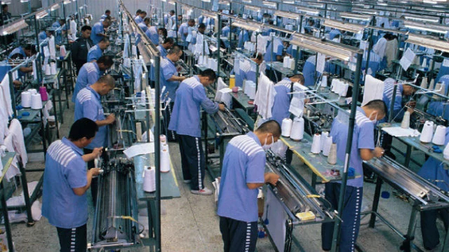 Inmates working in a prison textile plant.