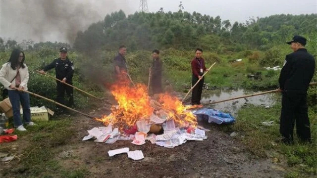 Illegal publications being burned in Guangdong Province’s Enping city last year.